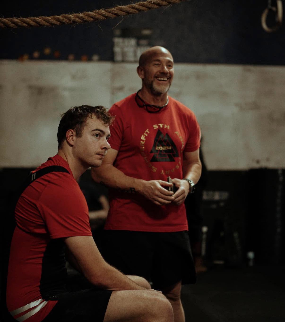 Jim Roncal laughing and coaching in a SemperFit shirt